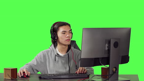 Asian-gamer-on-desktop-at-workstation